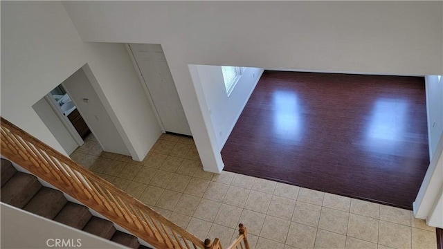 29746 Maxmillian Ave, Murrieta, CA 92563 - foyer entrance featuring light tile patterned floors, stairway, and baseboards