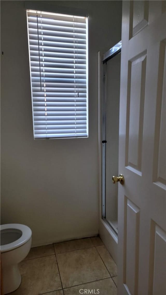29746 Maxmillian Ave, Murrieta, CA 92563 - full bathroom featuring a shower stall, tile patterned floors, and toilet