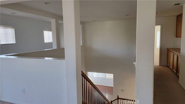 29746 Maxmillian Ave, Murrieta, CA 92563 - hallway with an upstairs landing, carpet flooring, and recessed lighting