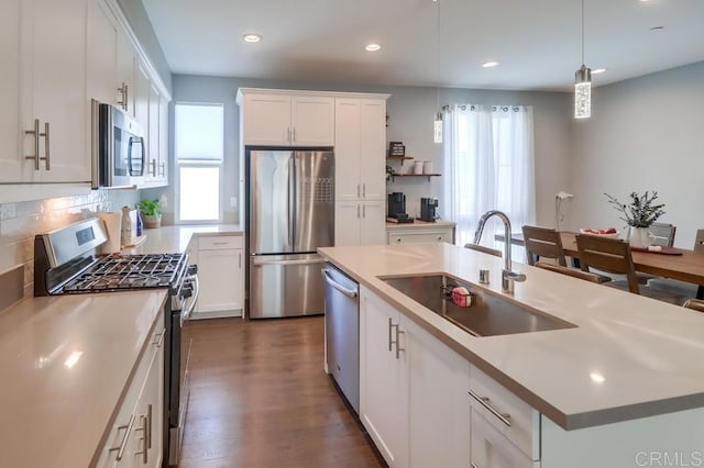 2140 Stellar Way Unit 4, Chula Vista, CA 91915 - kitchen featuring stainless steel appliances, plenty of natural light, an island with sink, white cabinetry, and recessed lighting