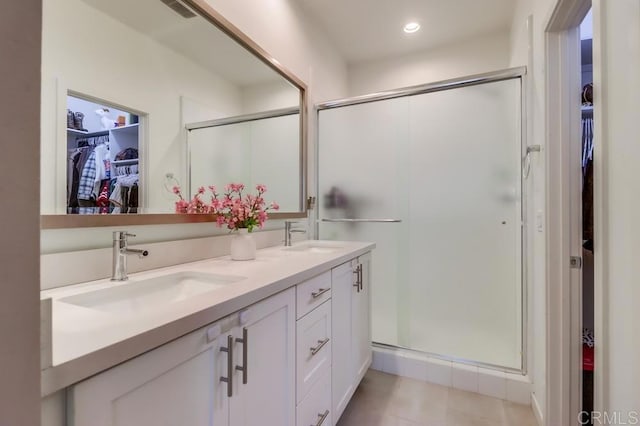 2140 Stellar Way Unit 4, Chula Vista, CA 91915 - full bath featuring a walk in closet, a stall shower, double vanity, tile patterned floors, and recessed lighting