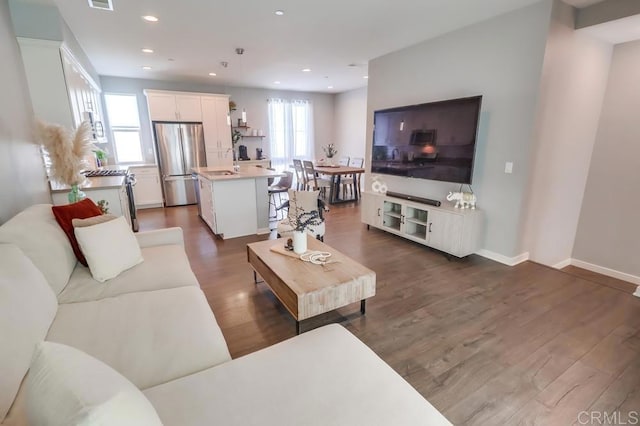 2140 Stellar Way Unit 4, Chula Vista, CA 91915 - living area with dark wood-style flooring and recessed lighting