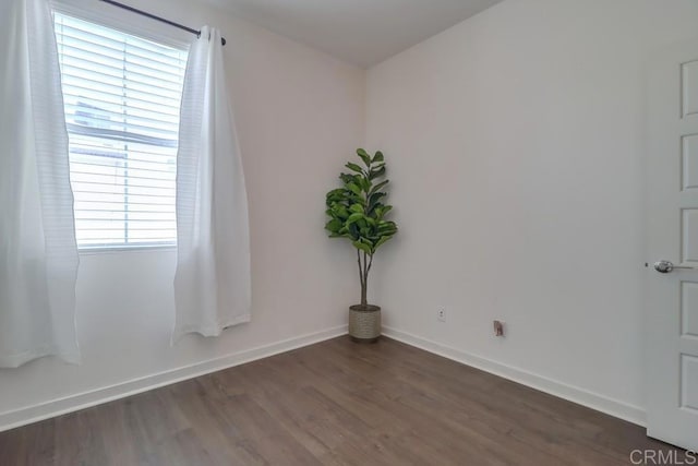 2140 Stellar Way Unit 4, Chula Vista, CA 91915 - unfurnished room with dark wood-style flooring and baseboards