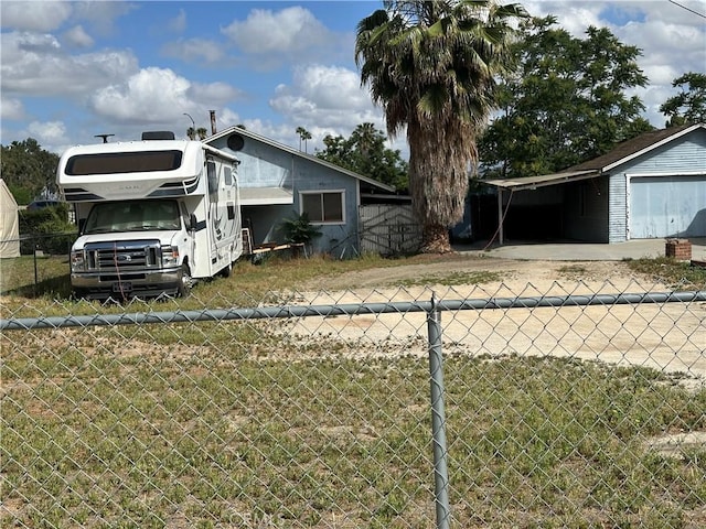 7423 Indiana Ave, Riverside, CA 92504 - view of side of property with fence and an attached carport