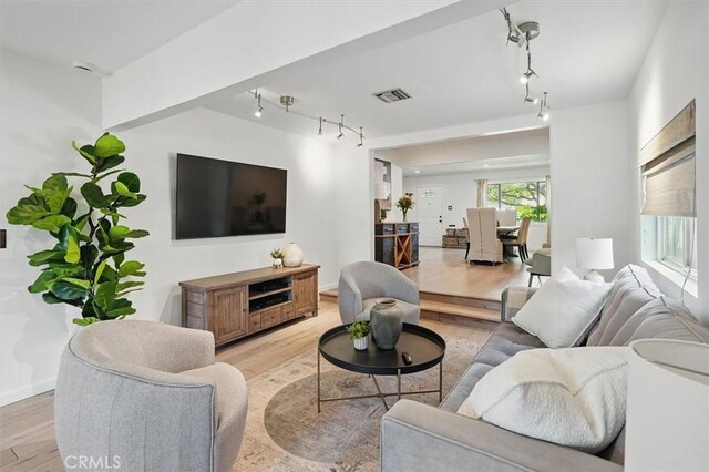 850 N Naomi St, Burbank, CA 91505 - living room featuring track lighting and light wood finished floors