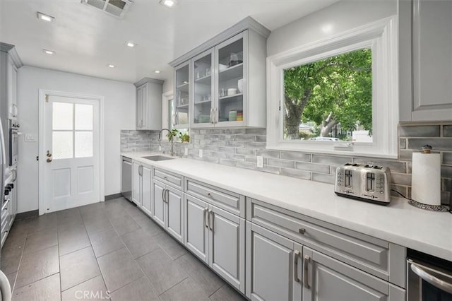 850 N Naomi St, Burbank, CA 91505 - kitchen featuring gray cabinets, appliances with stainless steel finishes, backsplash, plenty of natural light, and recessed lighting