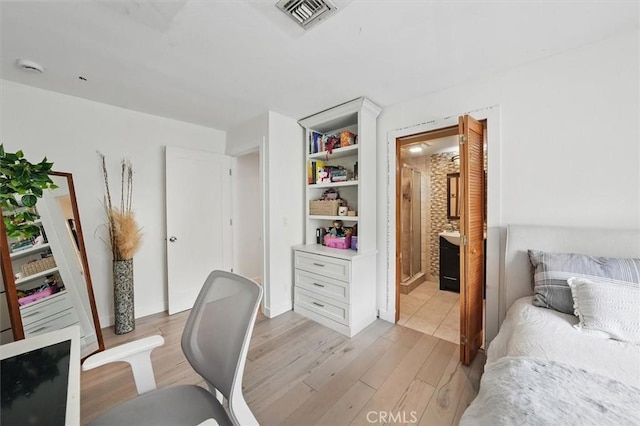 850 N Naomi St, Burbank, CA 91505 - bedroom with light wood-style floors, ensuite bathroom, and a desk