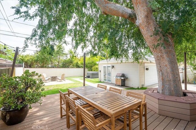 850 N Naomi St, Burbank, CA 91505 - wooden deck with outdoor dining space, a fire pit, grilling area, and an outdoor structure