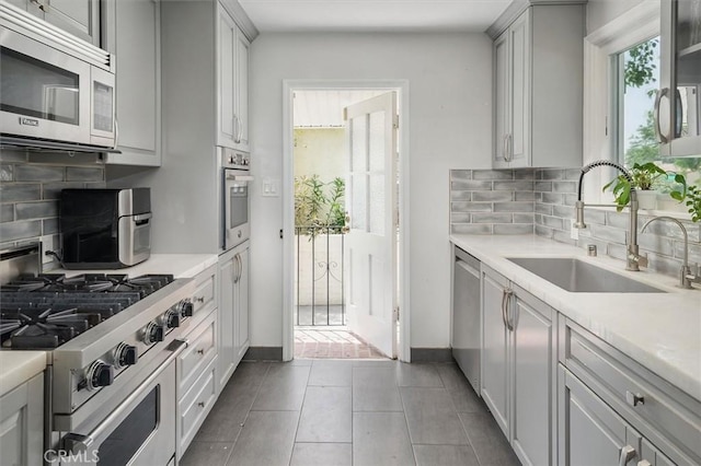 850 N Naomi St, Burbank, CA 91505 - kitchen featuring stainless steel appliances, backsplash, and light countertops