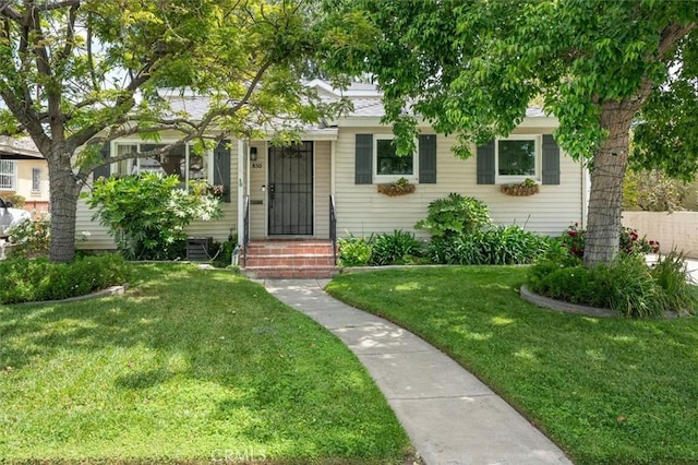 850 N Naomi St, Burbank, CA 91505 - obstructed view of property featuring a front yard