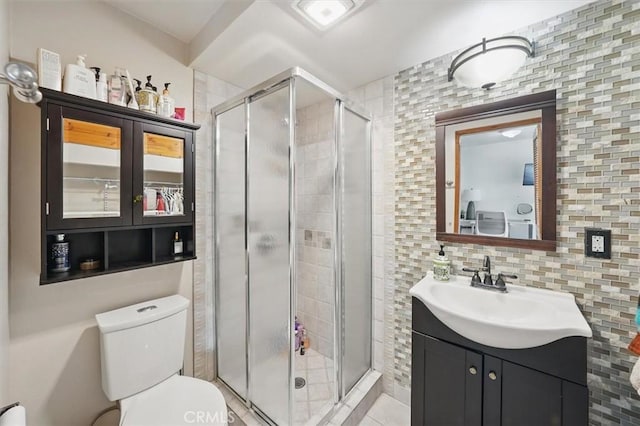 850 N Naomi St, Burbank, CA 91505 - full bathroom with vanity, a stall shower, tile walls, backsplash, and tile patterned floors