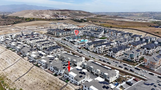 aerial overview of property's location featuring a mountain backdrop