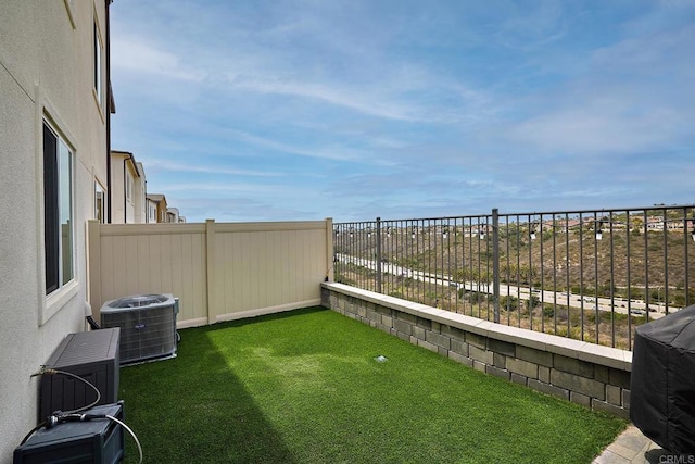 view of yard with central air condition unit