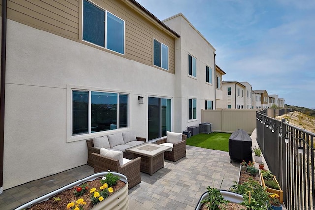 view of patio / terrace featuring outdoor lounge area, fence, a residential view, and cooling unit