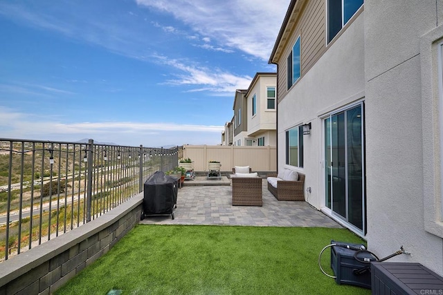 view of patio with grilling area and an outdoor living space