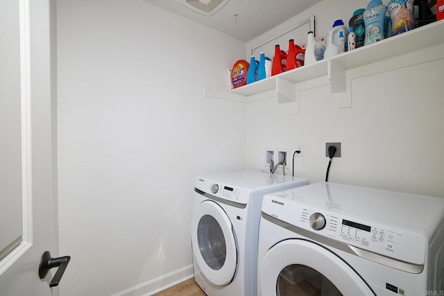 laundry area featuring washing machine and dryer