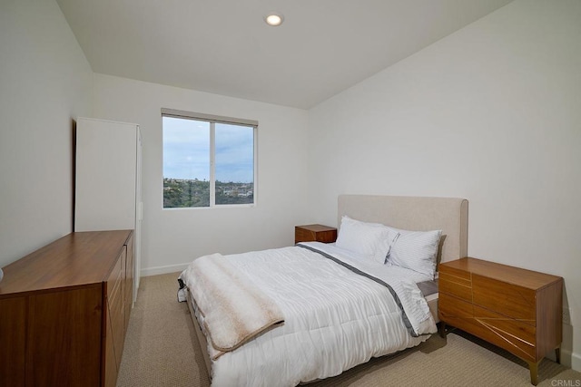 bedroom featuring light colored carpet, baseboards, and recessed lighting