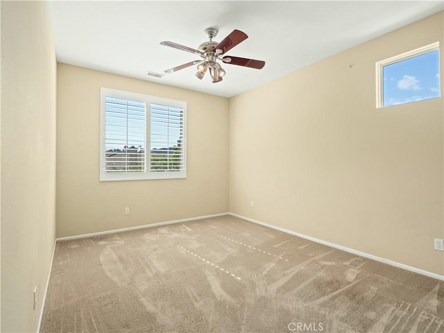 30375 June Rose Ct, Castaic, CA 91384 - empty room with plenty of natural light, a ceiling fan, carpet flooring, and baseboards