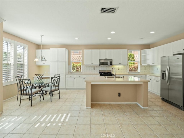 30375 June Rose Ct, Castaic, CA 91384 - kitchen featuring stainless steel appliances, backsplash, light countertops, light tile patterned floors, and recessed lighting