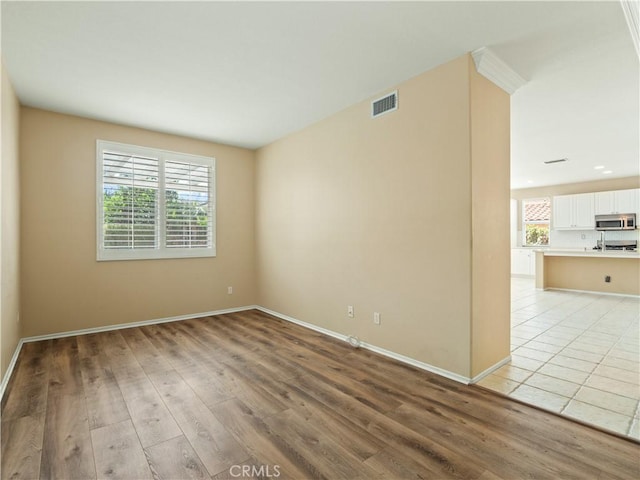 30375 June Rose Ct, Castaic, CA 91384 - empty room featuring light wood-style floors and baseboards