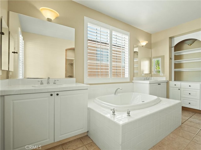 30375 June Rose Ct, Castaic, CA 91384 - full bath with two vanities, a bath, and tile patterned floors
