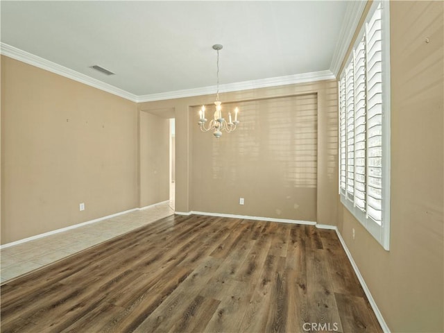 30375 June Rose Ct, Castaic, CA 91384 - unfurnished dining area featuring a chandelier, wood finished floors, crown molding, and baseboards