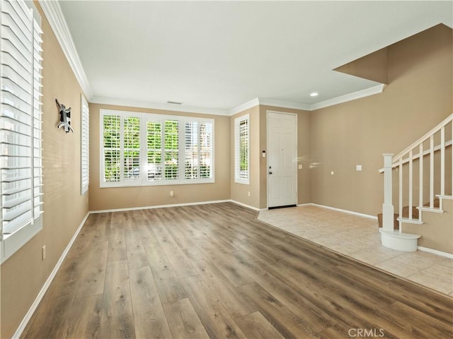 30375 June Rose Ct, Castaic, CA 91384 - entryway featuring ornamental molding, wood finished floors, baseboards, and stairs
