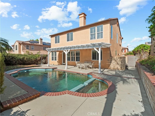 30375 June Rose Ct, Castaic, CA 91384 - rear view of property with a pergola, a patio area, stucco siding, a pool with connected hot tub, and a chimney