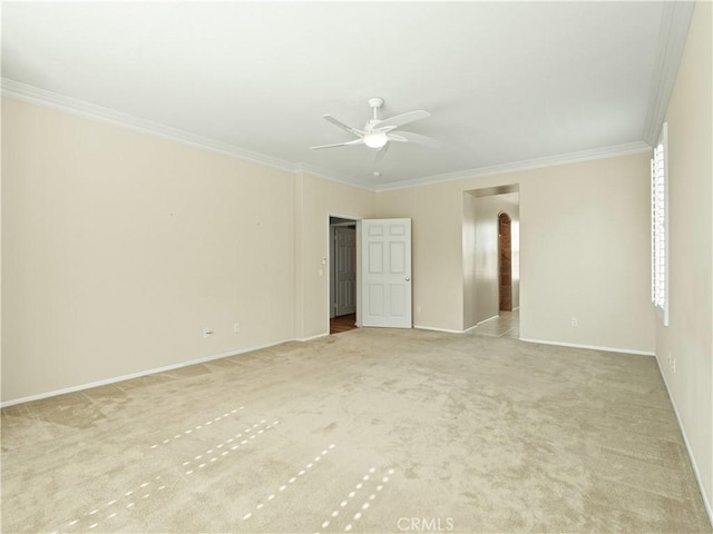 30375 June Rose Ct, Castaic, CA 91384 - unfurnished bedroom with crown molding, light colored carpet, baseboards, arched walkways, and a ceiling fan
