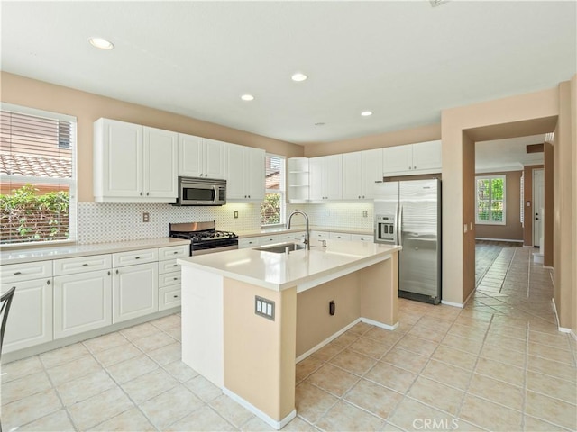 30375 June Rose Ct, Castaic, CA 91384 - kitchen with stainless steel appliances, a sink, plenty of natural light, tasteful backsplash, and recessed lighting