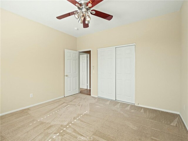 30375 June Rose Ct, Castaic, CA 91384 - unfurnished bedroom featuring carpet flooring, baseboards, a closet, and a ceiling fan