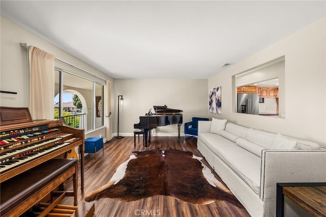 living room featuring dark wood-style floors and baseboards