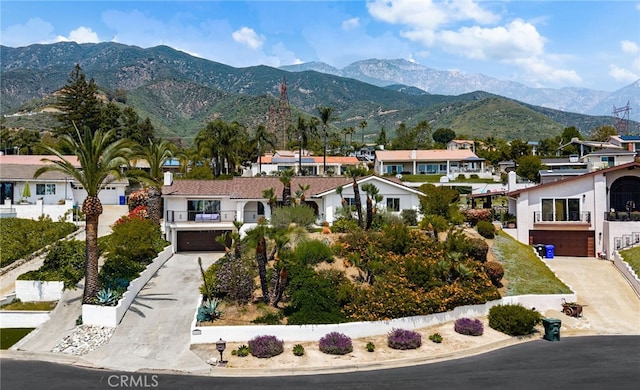 view of mountain background featuring nearby suburban area
