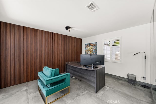 home office with concrete flooring