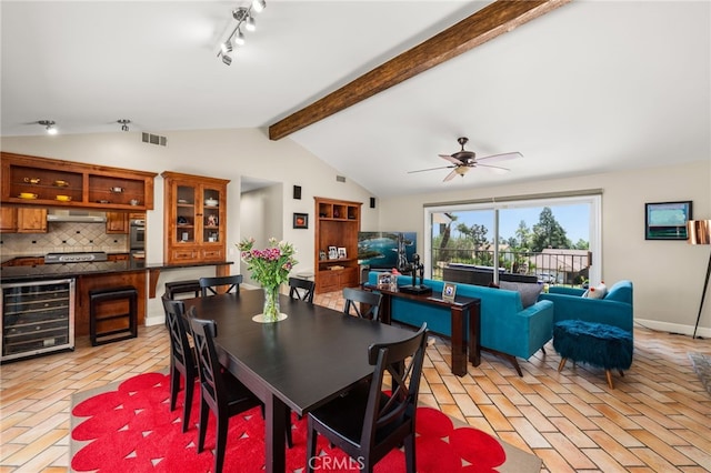 dining area with beverage cooler, brick flooring, and ceiling fan