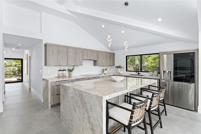 29951 Morongo Pl, Laguna Niguel, CA 92677 - kitchen with stainless steel refrigerator with ice dispenser, modern cabinets, a kitchen island, tasteful backsplash, and recessed lighting