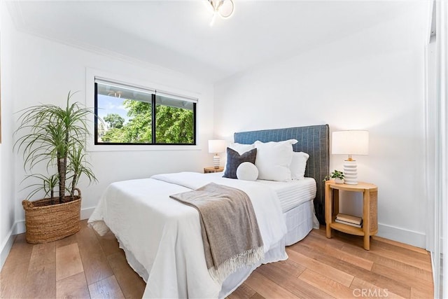 29951 Morongo Pl, Laguna Niguel, CA 92677 - bedroom with light wood-type flooring, baseboards, and ornamental molding