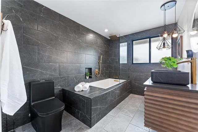29951 Morongo Pl, Laguna Niguel, CA 92677 - bathroom featuring tile walls, vanity, tiled shower / bath, and toilet