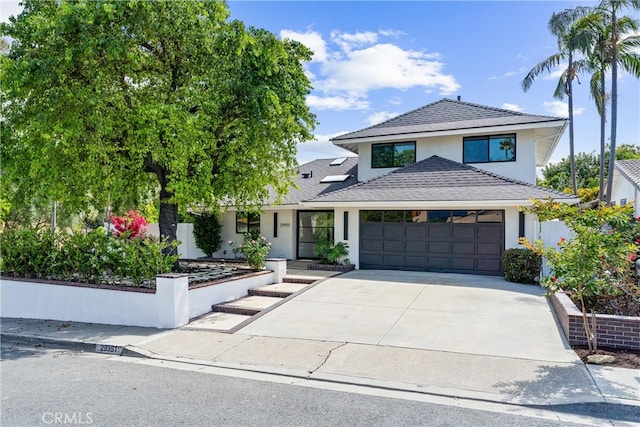 29951 Morongo Pl, Laguna Niguel, CA 92677 - view of front of house with stucco siding, a garage, and driveway