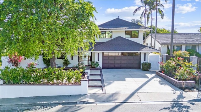 29951 Morongo Pl, Laguna Niguel, CA 92677 - view of front of home featuring a garage, concrete driveway, stucco siding, and a shingled roof