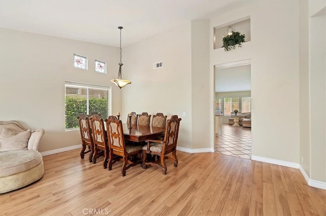 22523 White Sage St, Corona, CA 92883 - dining room featuring baseboards, plenty of natural light, and a high ceiling