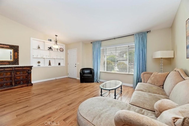 22523 White Sage St, Corona, CA 92883 - living room featuring light wood-type flooring and baseboards