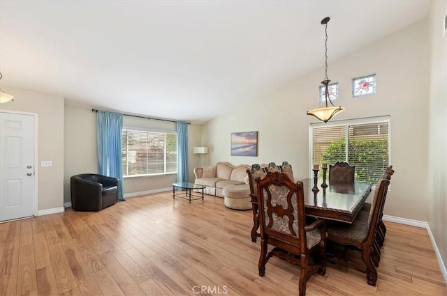 22523 White Sage St, Corona, CA 92883 - dining room featuring light wood-style floors, plenty of natural light, baseboards, and high vaulted ceiling