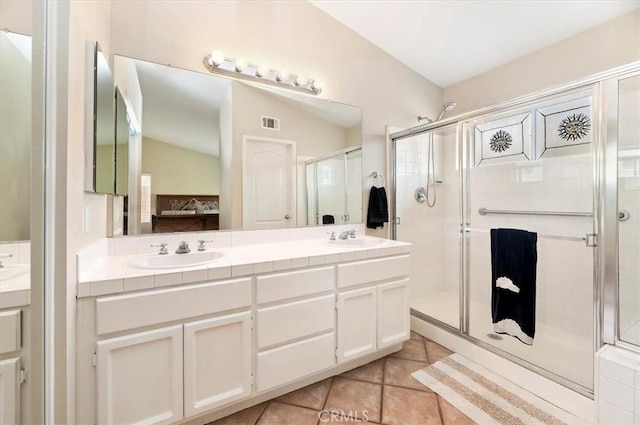 22523 White Sage St, Corona, CA 92883 - ensuite bathroom with double vanity, a shower stall, tile patterned flooring, and lofted ceiling