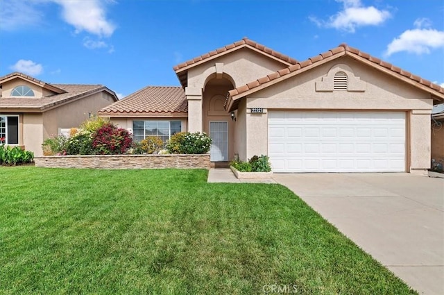 22523 White Sage St, Corona, CA 92883 - mediterranean / spanish-style house featuring a front lawn, stucco siding, a garage, and driveway
