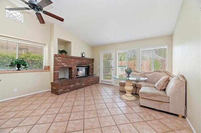 22523 White Sage St, Corona, CA 92883 - living area with lofted ceiling, a fireplace, a ceiling fan, light tile patterned floors, and baseboards