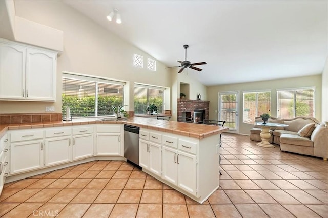 22523 White Sage St, Corona, CA 92883 - kitchen featuring dishwasher, open floor plan, light tile patterned floors, and high vaulted ceiling