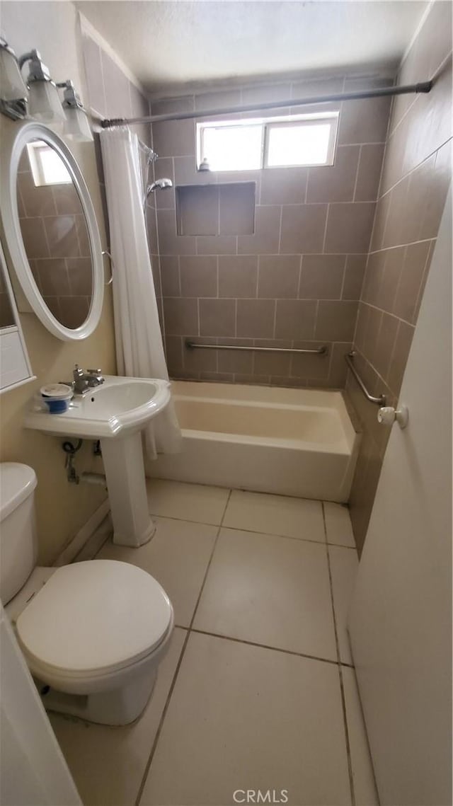 44709 6th St E, Lancaster, CA 93535 - bathroom featuring toilet, shower / bath combination with curtain, tile patterned floors, and a sink