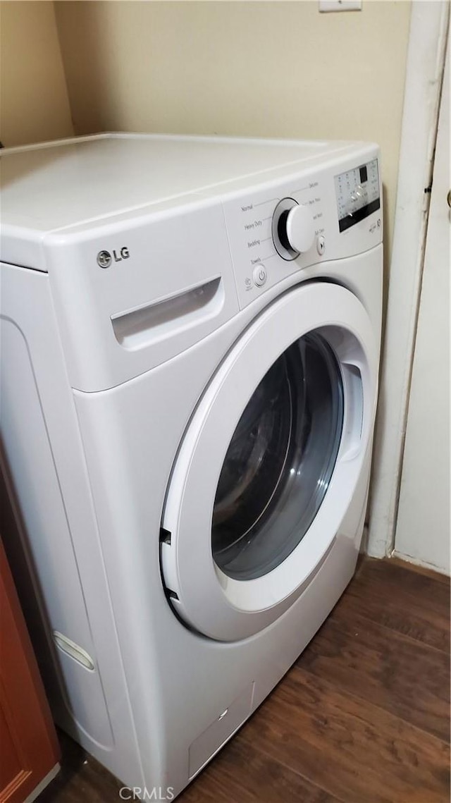 44709 6th St E, Lancaster, CA 93535 - laundry area with washer / dryer and dark wood-style floors
