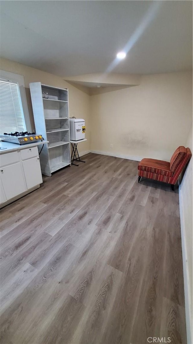 44709 6th St E, Lancaster, CA 93535 - basement with light wood-type flooring and baseboards